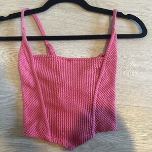 Pink cropped urban outfitters top! Adjustable straps in the back